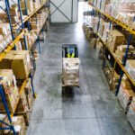 Warehouse man worker with forklift.